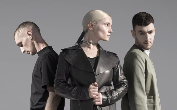 HD wallpaper featuring the musical group Clean Bandit, posed against a grey background for a stylish desktop backdrop.
