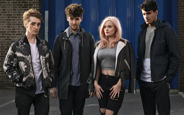 HD desktop wallpaper featuring the music group posing together outdoors.