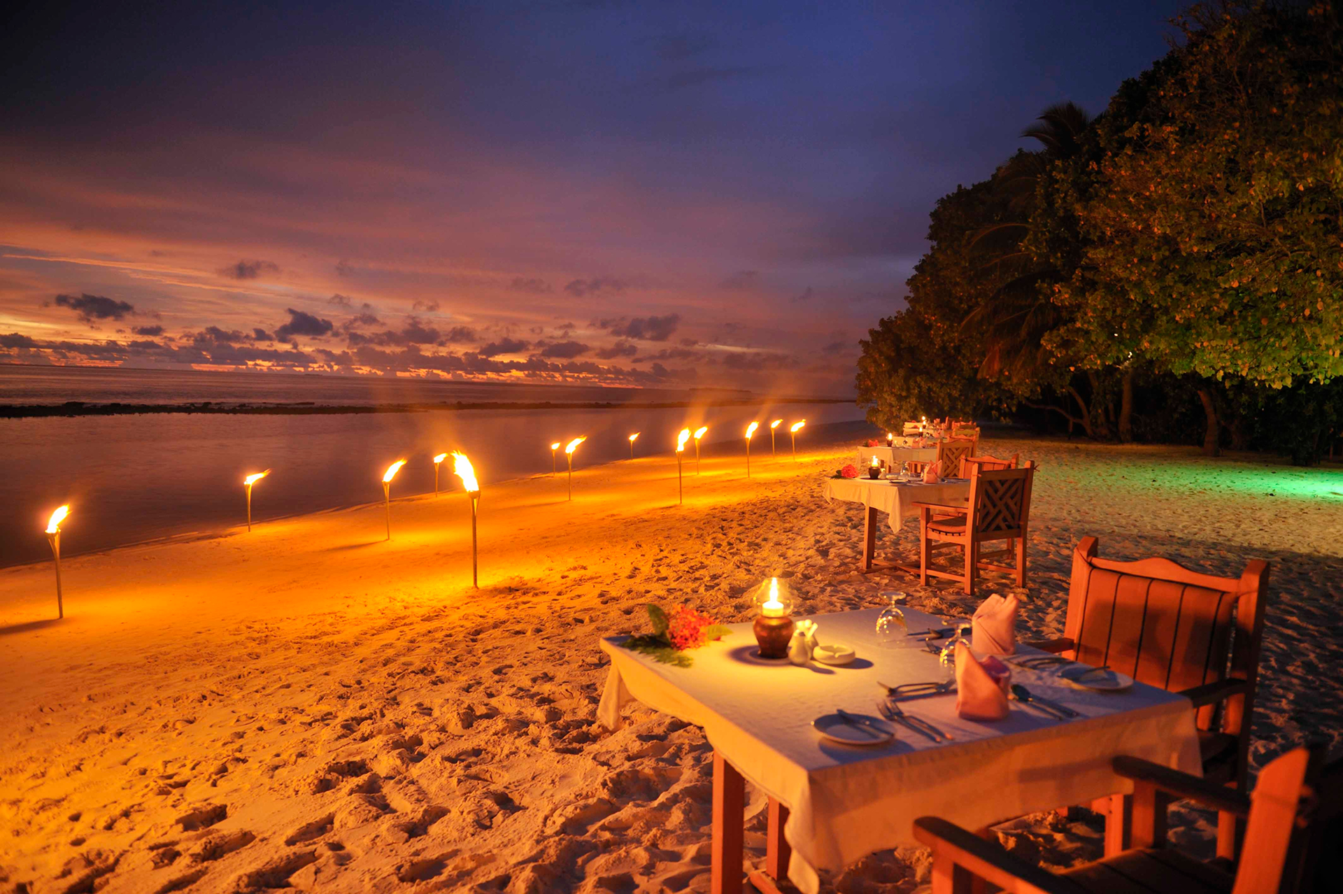 Dining on the Beach at Night in the Maldives HD Wallpaper | Background