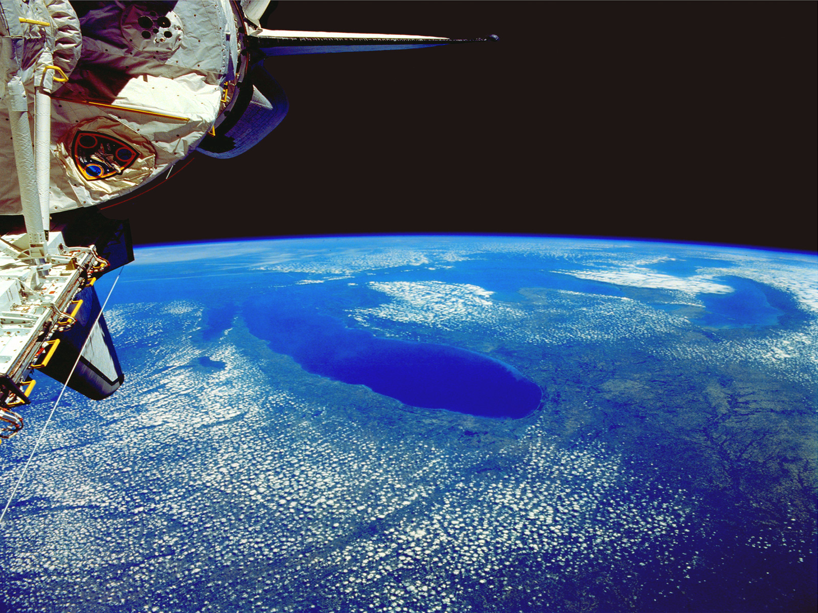 HD desktop wallpaper featuring the Earth viewed from space.