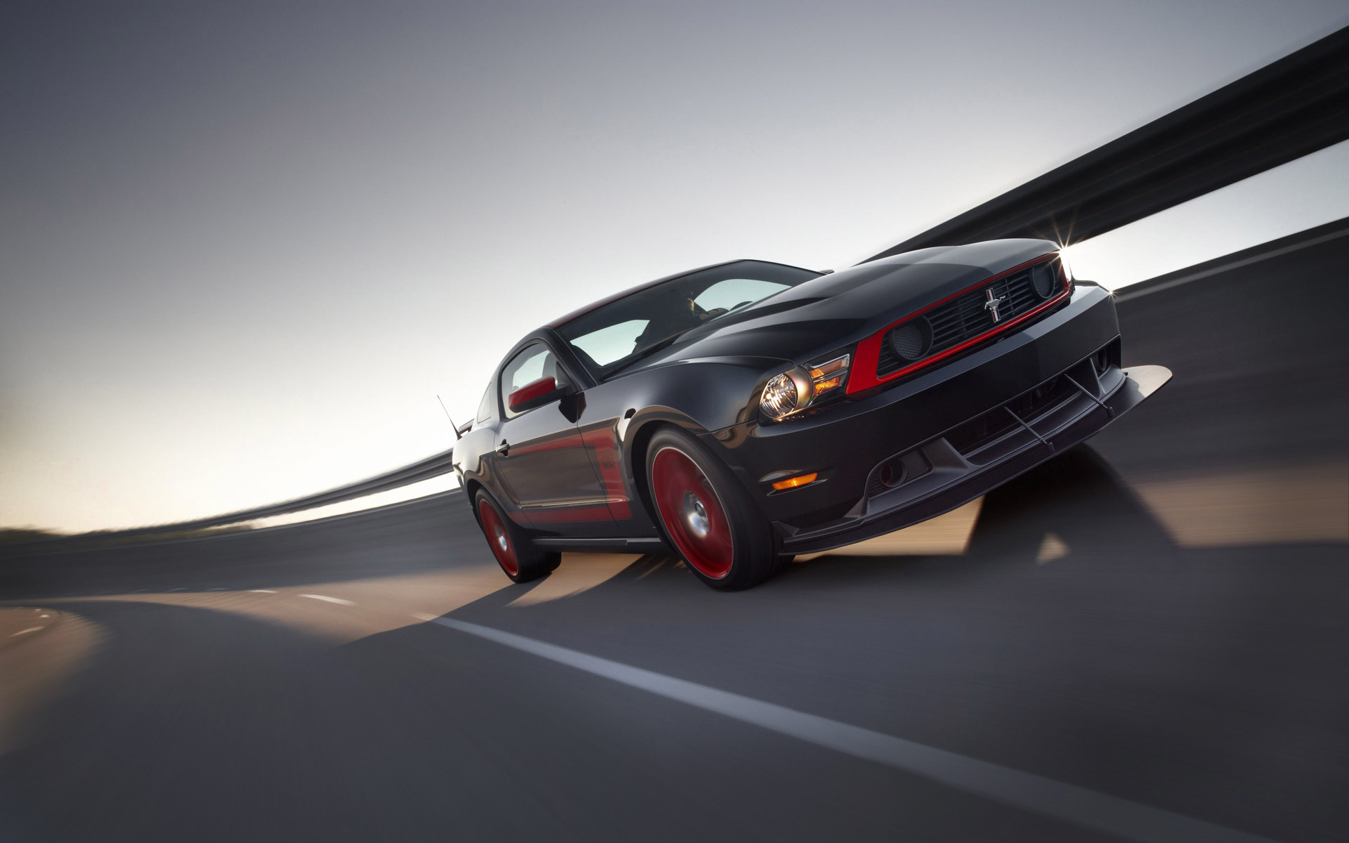 Ford Mustang Boss 302 Laguna Seca: A sleek and powerful car surrounded by a vibrant background.