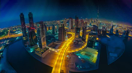 Fisheye aerial night cityscape of Dubai, United Arab Emirates, vibrant man-made skyline and illuminated roads in an HD desktop wallpaper background.