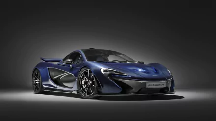 HD desktop wallpaper featuring a sleek and stylish McLaren P1 supercar against a dark gradient background, highlighting the vehicle's aerodynamic design and striking blue color.