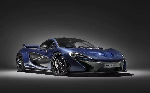 HD desktop wallpaper featuring a sleek and stylish McLaren P1 supercar against a dark gradient background, highlighting the vehicle's aerodynamic design and striking blue color.