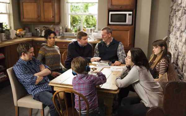 HD desktop wallpaper of 'The A Word' featuring a family scene around a kitchen table.