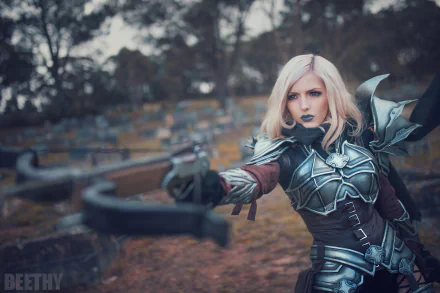 A woman cosplaying as a Demon Hunter from Diablo III stands poised with a crossbow in a detailed and intricate costume. The background is a high-definition forest scene set as a desktop wallpaper.