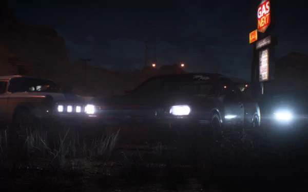 HD PC wallpaper featuring a Nissan Skyline GT-R V-Spec II from Need for Speed Payback, set in a dark, moody environment near a gas station.