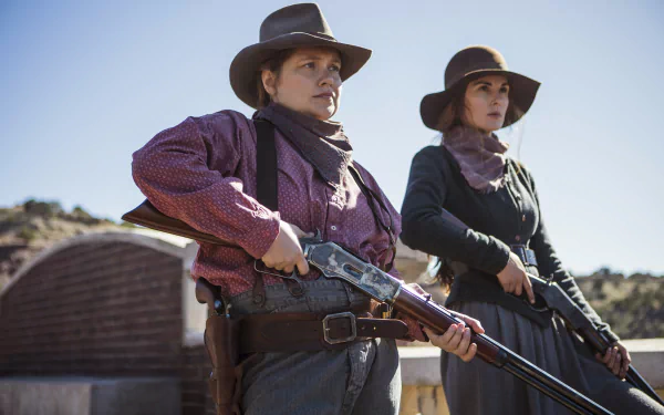 HD desktop wallpaper featuring two women in Western attire with guns, representing a scene tagged with Godless.