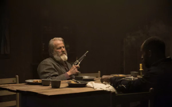 HD desktop wallpaper from Godless showing two characters in a dramatic, dimly-lit scene, one holding a gun at a table.