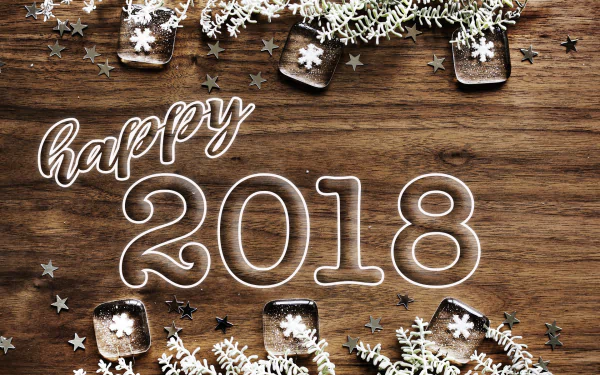 A festive HD desktop wallpaper celebrating New Year 2018, featuring Happy 2018 text surrounded by decorations and stars on a wooden background.