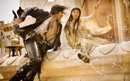 Gemma Arterton and Jake Gyllenhaal in a dynamic scene from Prince of Persia: The Sands of Time, depicted in a captivating HD wallpaper.