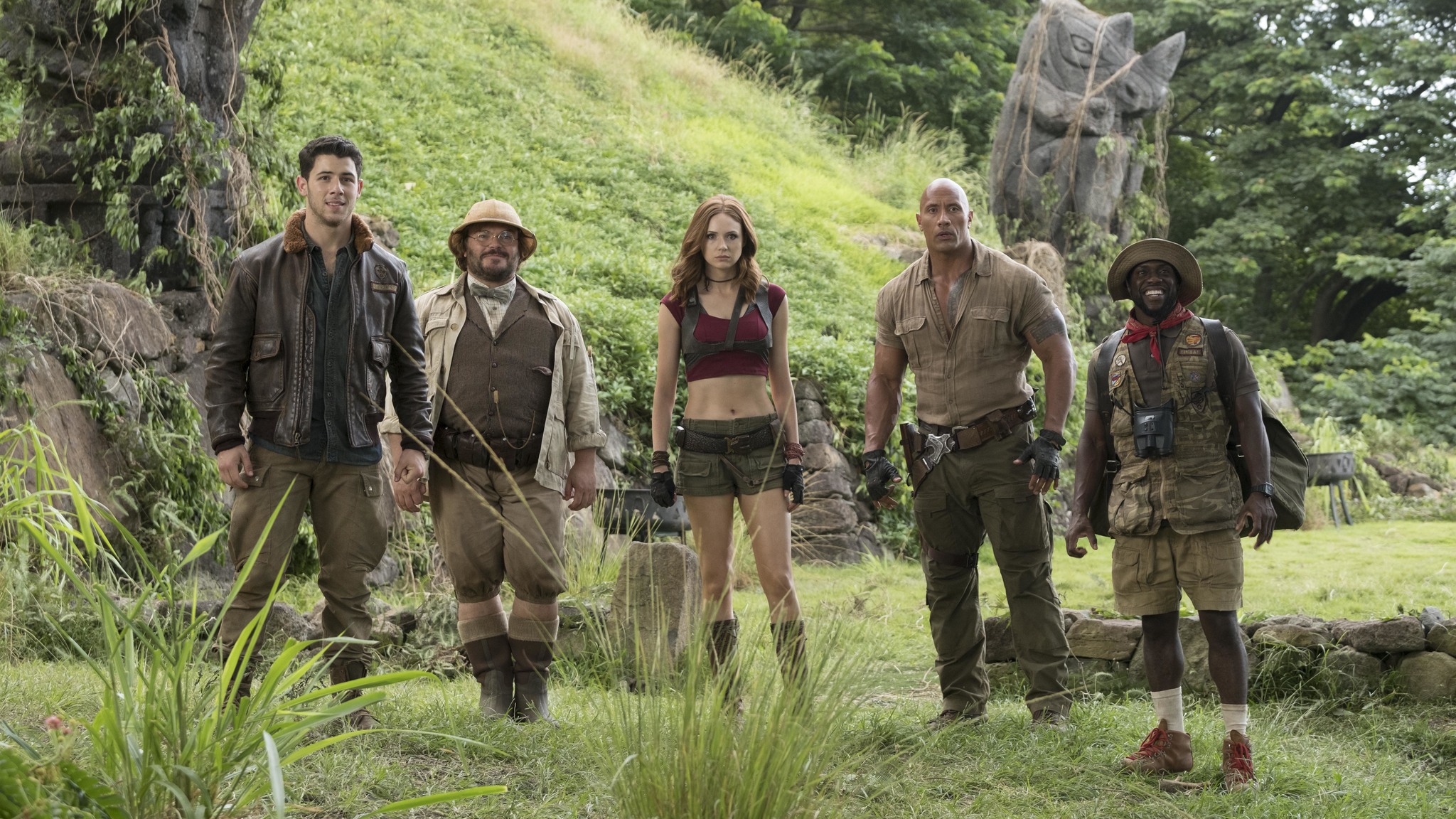 HD wallpaper of Jumanji: Welcome to the Jungle featuring the main cast posing in a jungle setting.