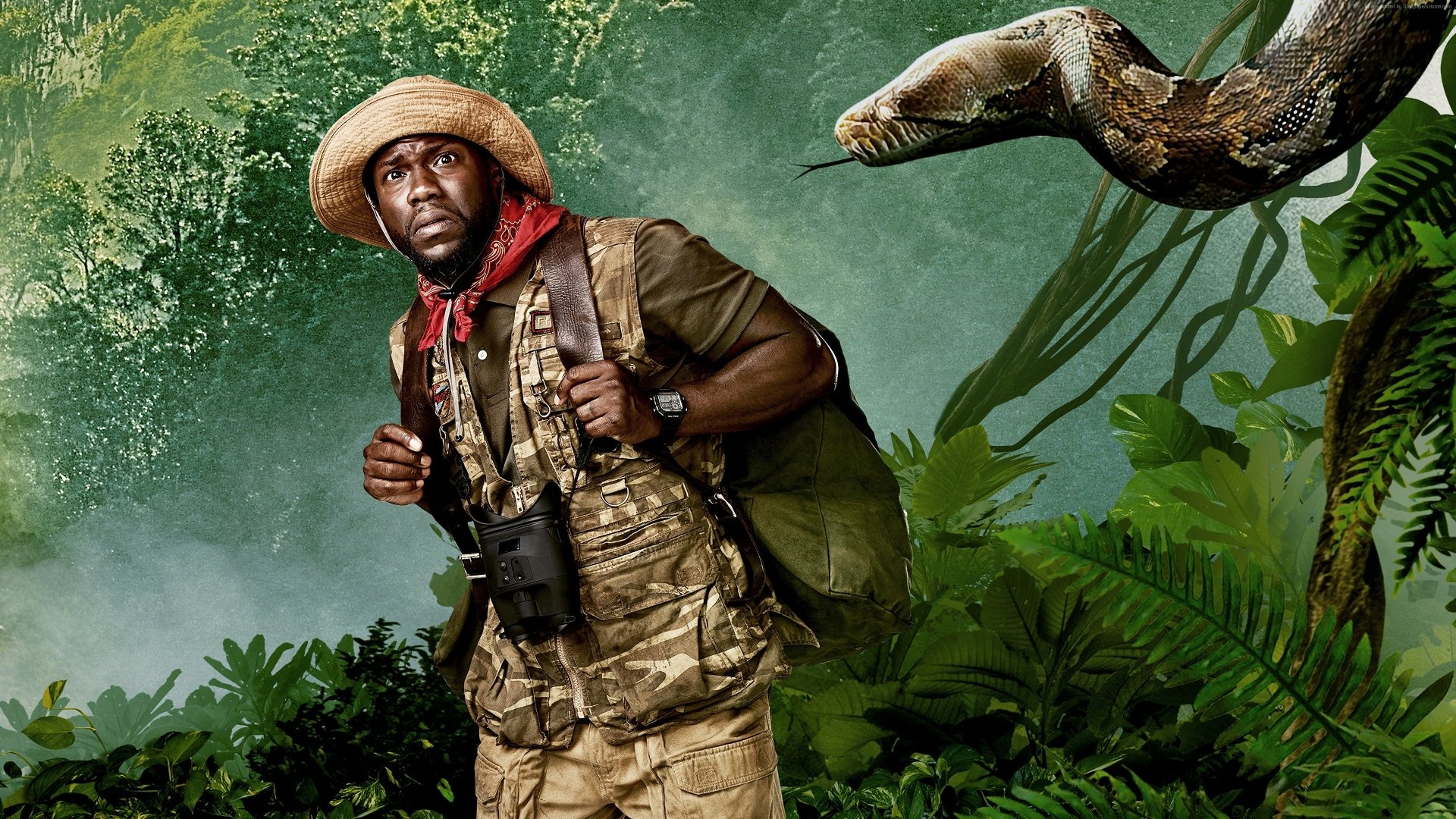 4K Ultra HD wallpaper featuring Kevin Hart as a character in Jumanji: Welcome to the Jungle, dressed for adventure with a boa constrictor in a dense jungle background.