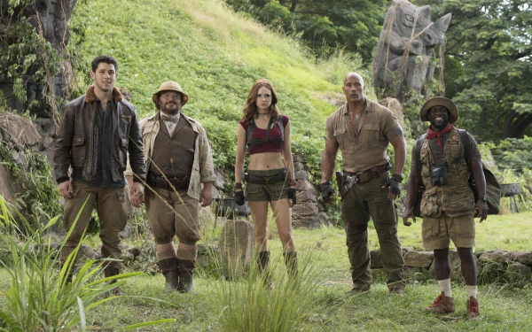 HD wallpaper of Jumanji: Welcome to the Jungle featuring the main cast posing in a jungle setting.