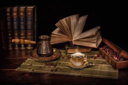 HD still life desktop wallpaper featuring an open book, a cup of coffee, and scattered coffee beans on a bamboo mat, all set against a backdrop of books and dim lighting.