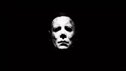 A striking black and white HD wallpaper featuring Michael Myers from the classic Halloween (1978) movie, capturing his iconic expression against a dark background.