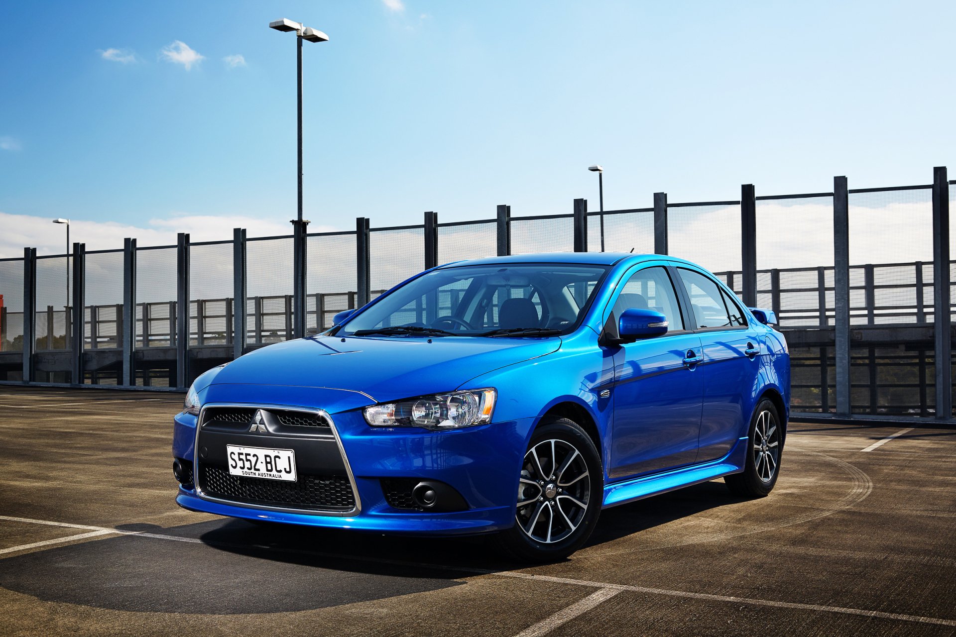 Download Car Mitsubishi Vehicle Mitsubishi Lancer HD Wallpaper