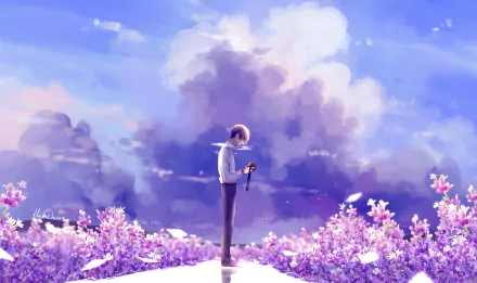 An anime character stands in a field of pink flowers, holding a camera under a vibrant blue sky with fluffy clouds. This HD desktop wallpaper captures a serene and dreamy scene.