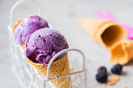 8K Ultra HD PC desktop wallpaper and background: vibrant purple ice cream scoops in waffle cones, food close-up with an empty cone and berries blurred behind.