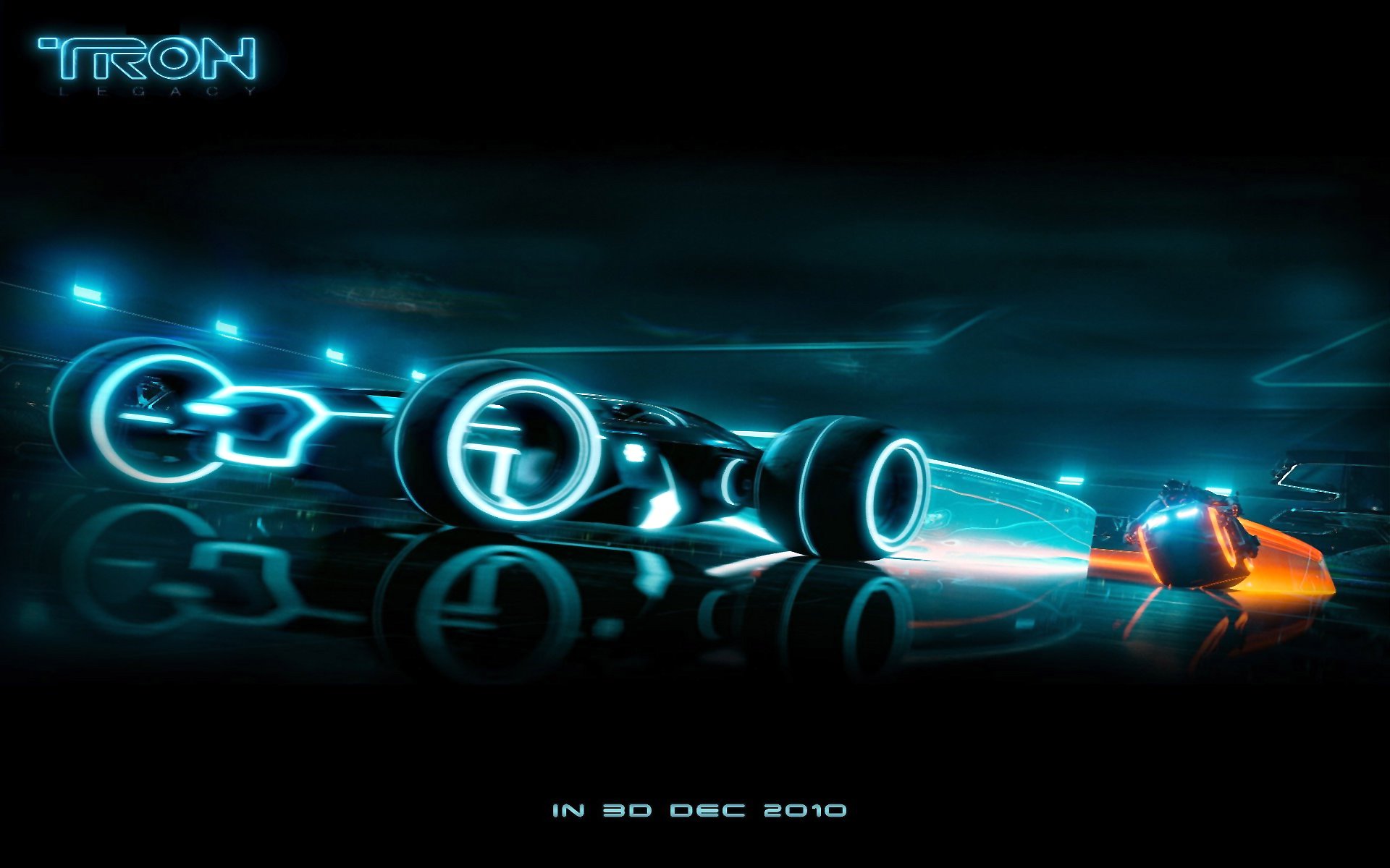 TG 500 Tron Legaci HD desktop wallpaper depicting blue light trails on a dark background.