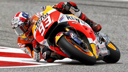 HD wallpaper featuring Marc Marquez racing on his Repsol Honda MotoGP bike, captured in dynamic motion on the track.