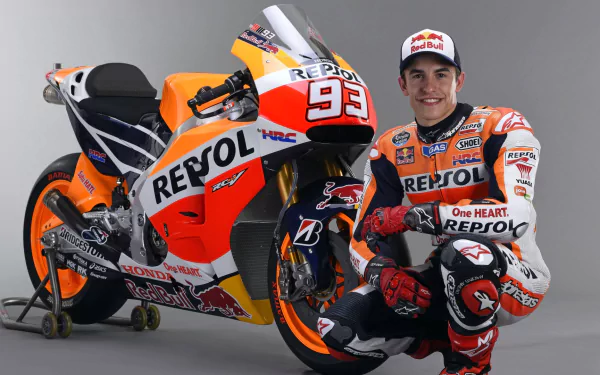 High-definition PC wallpaper featuring MotoGP rider Marc Marquez in Repsol Honda racing gear beside his orange Repsol Honda motorcycle.