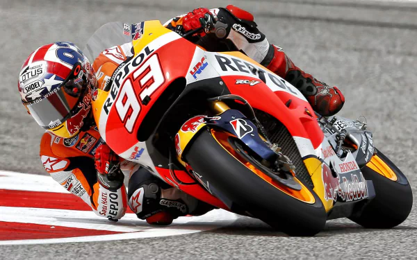 HD wallpaper featuring Marc Marquez racing on his Repsol Honda MotoGP bike, captured in dynamic motion on the track.