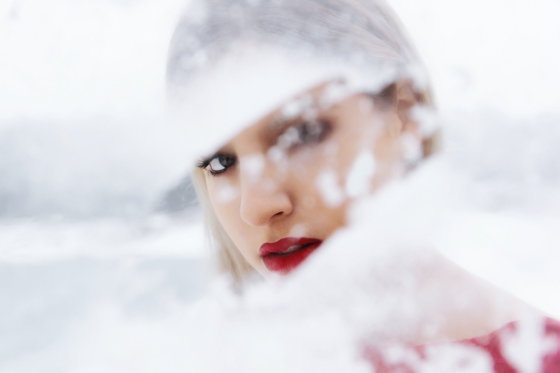 HD PC desktop wallpaper featuring a close-up of a woman's face with bold red lipstick, softly blurred with a dreamy, frosted effect.