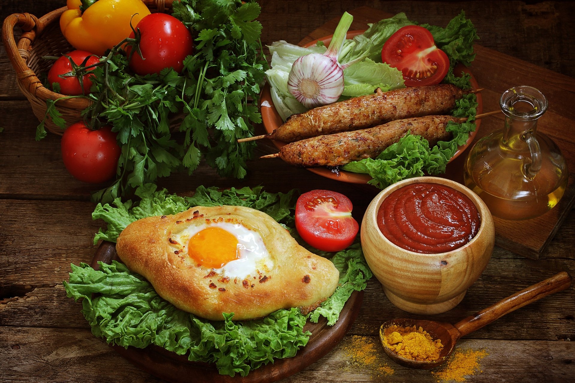 HD desktop wallpaper featuring a still life of fresh tomatoes, an egg baked in bread, ketchup, herbs, and spices arranged on a rustic wooden table.