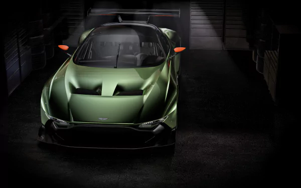Aston Martin Vulcan hypercar race car in a dark garage, showcased as a striking 4K Ultra HD PC desktop wallpaper and background.