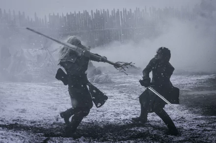 HD desktop wallpaper of Jon Snow battling a white walker in a snowy scene from the TV show Game Of Thrones.