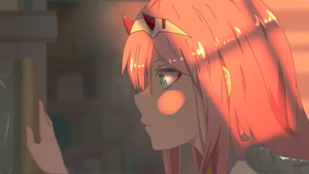 Close-up of Zero Two from *Darling in the FranXX*, featuring her distinctive pink hair and expressive eyes, set against a softly lit background, creating an HD anime wallpaper feel.