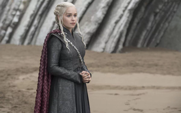 4K Ultra HD wallpaper featuring Emilia Clarke as Daenerys Targaryen from the TV show Game of Thrones, standing with a braided hairstyle and dark outfit.