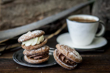 HD PC desktop wallpaper and background: coffee with stacked cream-filled biscuits/cookies dusted with powdered sugar on a rustic wooden table, food-themed.