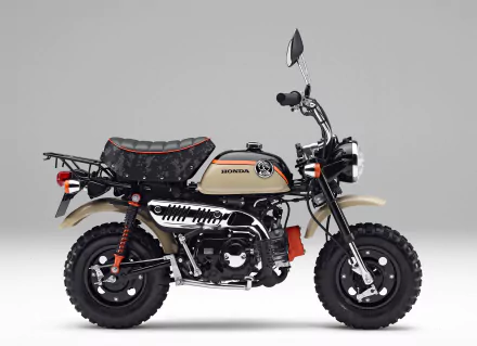 HD desktop wallpaper featuring a Honda Monkey vehicle with a retro design and beige and black color scheme against a plain gray background.