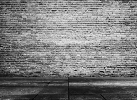 4K Ultra HD PC desktop wallpaper: grayscale photo of a man-made brick wall and concrete pavement, gritty urban texture.