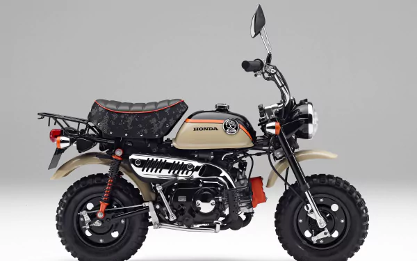 HD desktop wallpaper featuring a Honda Monkey vehicle with a retro design and beige and black color scheme against a plain gray background.