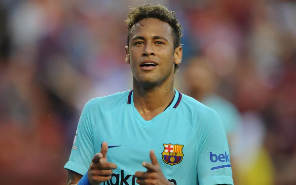 HD PC desktop wallpaper featuring Neymar, the Brazilian soccer star, in his FC Barcelona kit during a match.