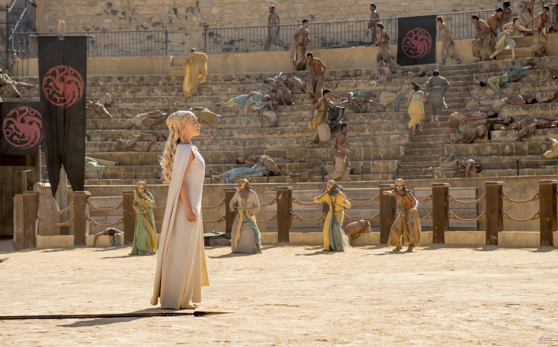 Daenerys Targaryen stands in the arena of Meereen from Game of Thrones, captured in a high-definition TV show desktop wallpaper scene.