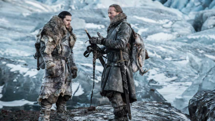 HD PC desktop wallpaper: Jorah Mormont and Jon Snow from the TV show Game of Thrones, clad in furs on a windswept icy landscape.