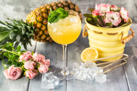 HD desktop wallpaper featuring a refreshing cocktail with ice cubes, a pineapple, pink roses, and a yellow pot with flowers in a vibrant still life composition.