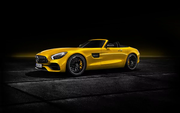 Yellow Mercedes-AMG GT S cabriolet supercar showcased in 4K Ultra HD, highlighting its sleek design and sporty elegance on a dark background.