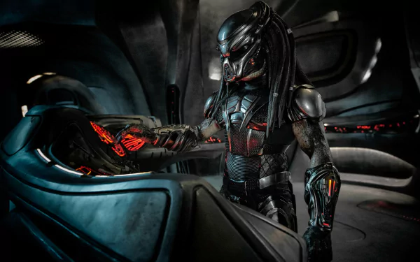 HD PC desktop wallpaper featuring the menacing Predator from The Predator movie, showcasing its detailed armor and glowing red accents in a dark sci-fi setting.