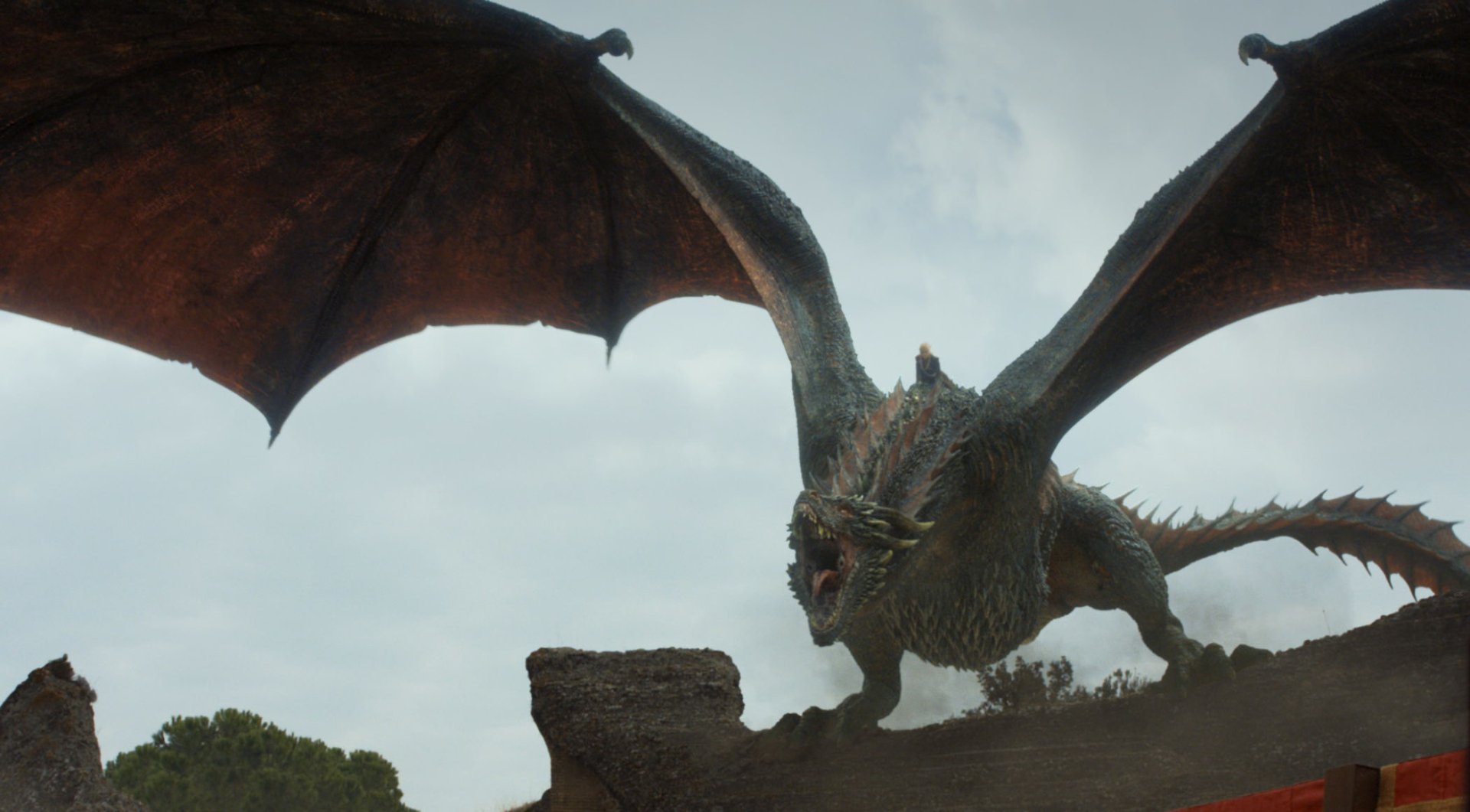 HD desktop wallpaper featuring Drogon, the dragon from Game of Thrones, soaring with wings spread against a cloudy sky, linked to Daenerys Targaryen's storyline.