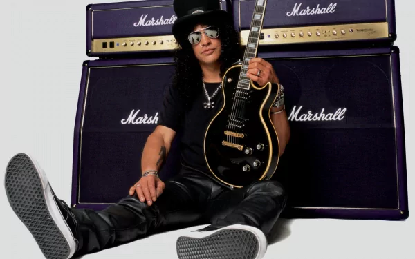 A high-definition desktop wallpaper featuring Slash, the iconic guitarist from Guns N' Roses, sitting with his guitar in front of Marshall amplifiers. A striking music-themed background.