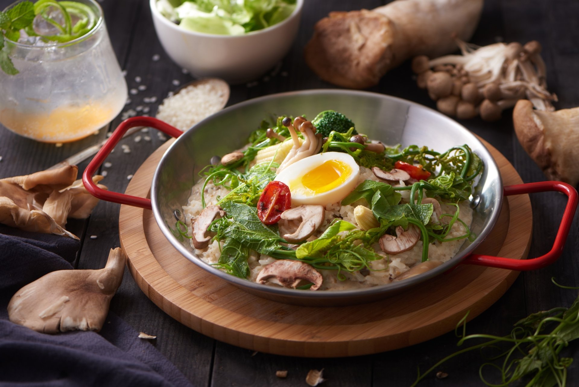HD PC desktop wallpaper featuring a vibrant still life of a hearty meal with vegetables, mushrooms, an egg, and fresh herbs on a rustic table setting.