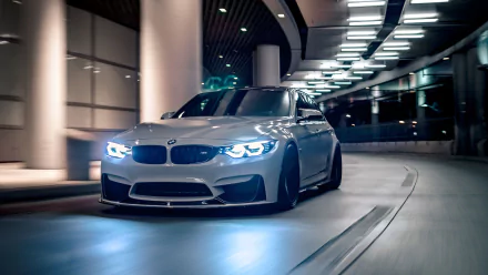 HD PC desktop wallpaper featuring a sleek BMW M3 driving through a modern, illuminated tunnel at night.