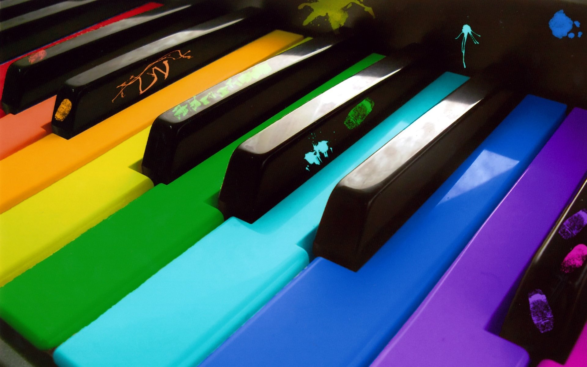 Colorful piano keyboard with rainbow keys, artistic HD desktop wallpaper.