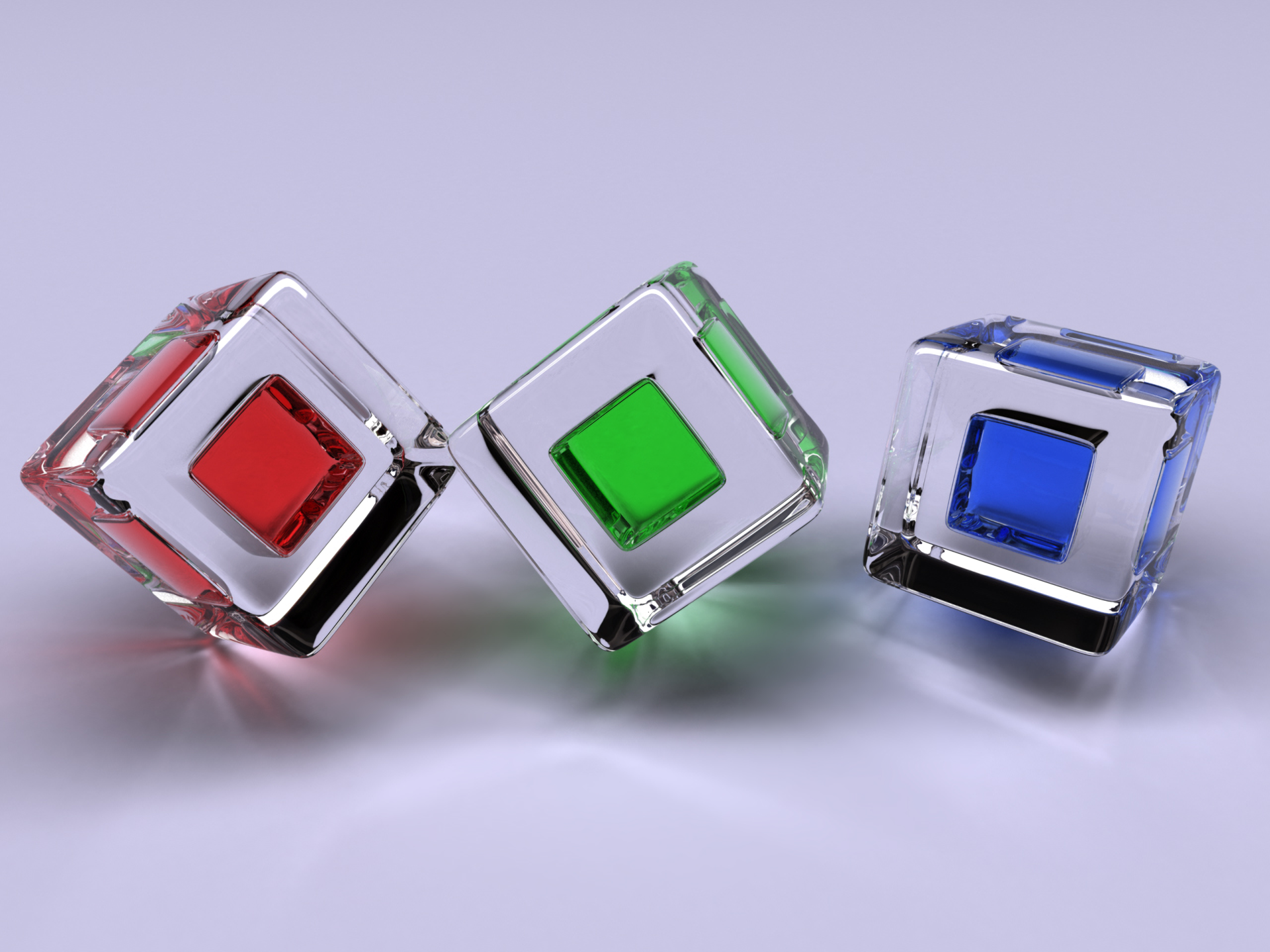 An abstract image featuring three colorful cubes—red, green, and blue—set against a minimalist background, designed as a vibrant HD desktop wallpaper and background.