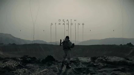 HD desktop wallpaper of the video game Death Stranding, featuring a lone character standing against a desolate, rocky landscape with mountains in the background and the title Death Stranding above.
